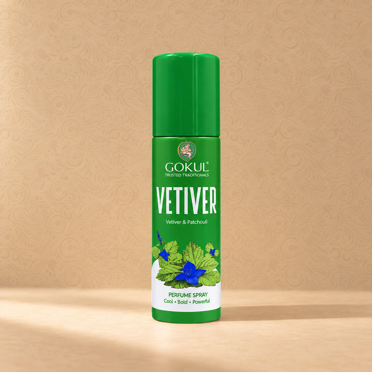 A green bottle of Gokul Vetiver Perfume Spray, featuring a matching green cap, set against a warm beige textured background with a soft shadow.